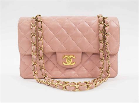 chanel light small pink shoulder bag with silver hardware|Chanel pink quilted handbag.